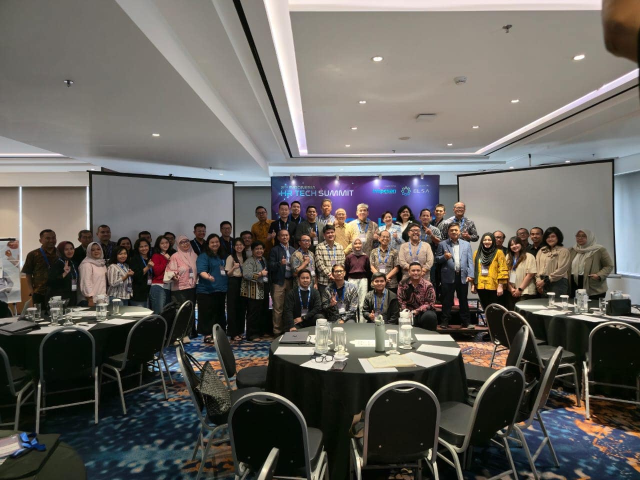 Evocom delegates and HR leaders at the 2nd Indonesia HR Tech Summit discussing human-centric AI in HR